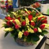Корзина с тюльпанами и декоративной зеленью