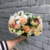 Букет с розами, гвоздикой, эустомой, альстромерией, кустовой хризантемой и декоративной зеленью в упаковке